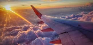 Picture of an airplane wing and sunset view