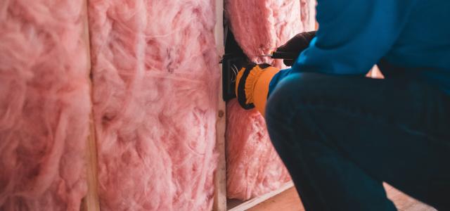 person in blue pants sitting on brown wooden floor by Erik Mclean courtesy of Unsplash.